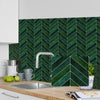 A dark green chevron patterned self-adhesive wall sticker applied to a kitchen backsplash.