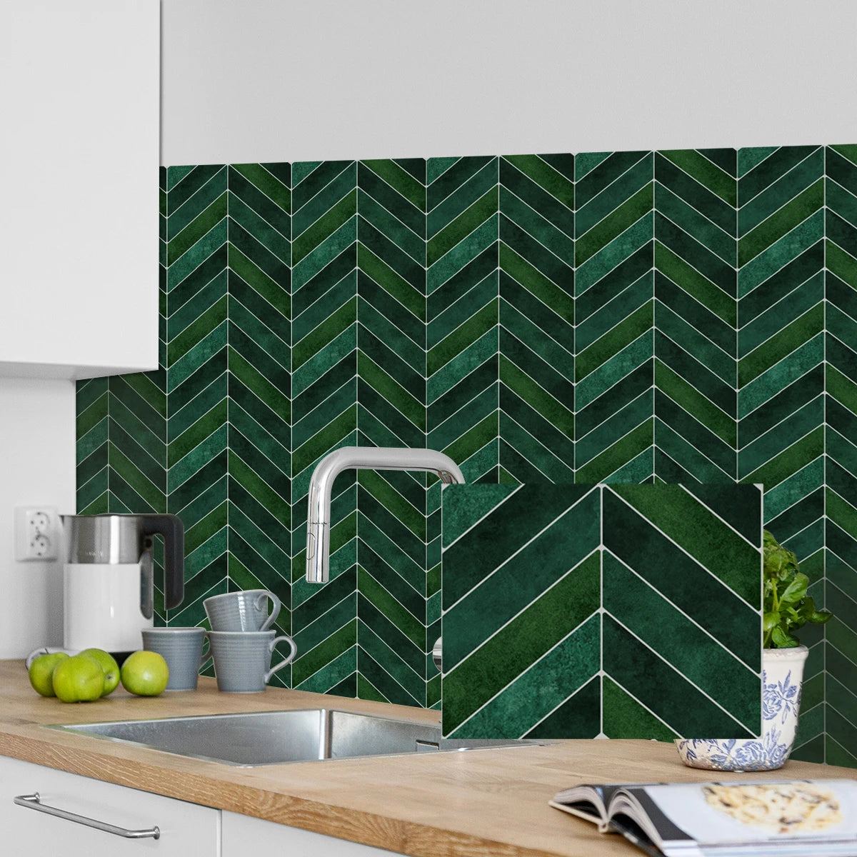 A dark green chevron patterned self-adhesive wall sticker applied to a kitchen backsplash.