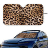 Leopard print car windshield sunshade placed on a blue car windshield.