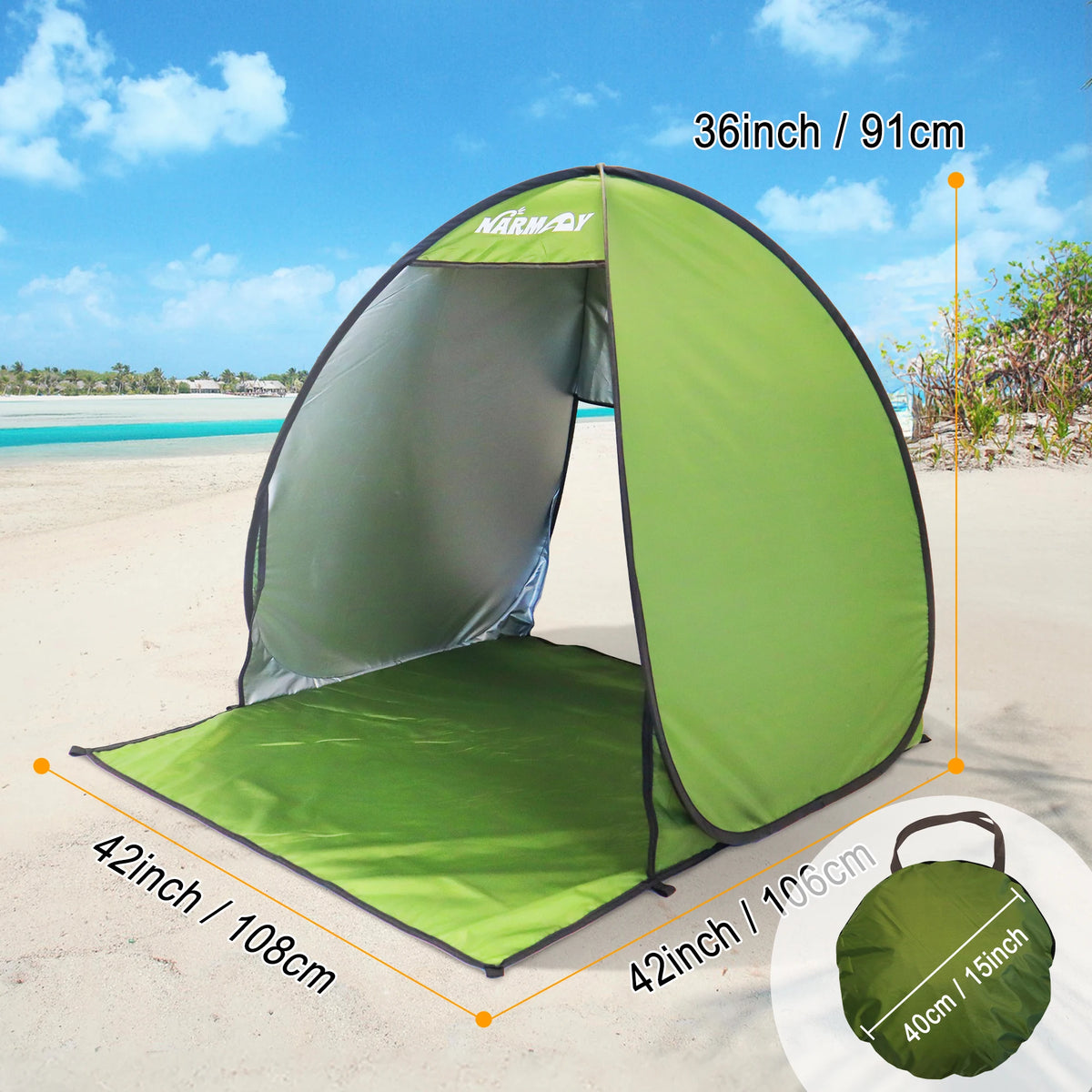 A green instant pop-up beach tent is set up on a sandy beach under a blue sky.
