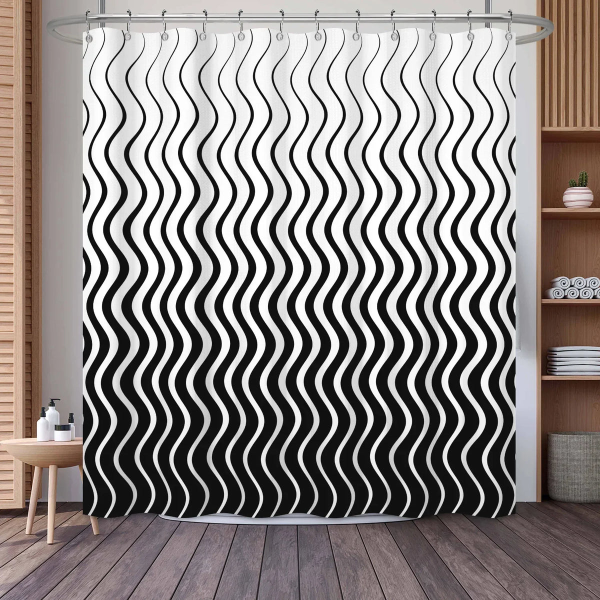 Black and white wavy stripe shower curtain hanging in a bathroom setting