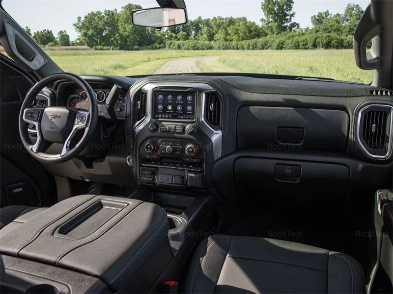 Interior view of a Chevrolet Silverado or GMC Sierra dashboard with a custom fit cover installed.