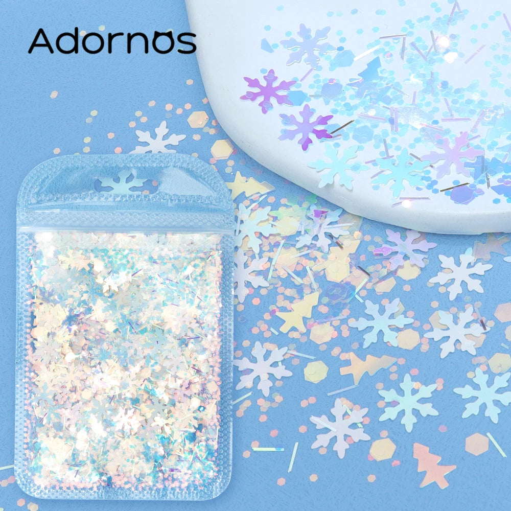 A clear plastic container filled with iridescent holographic star sequins scattered on a blue surface.