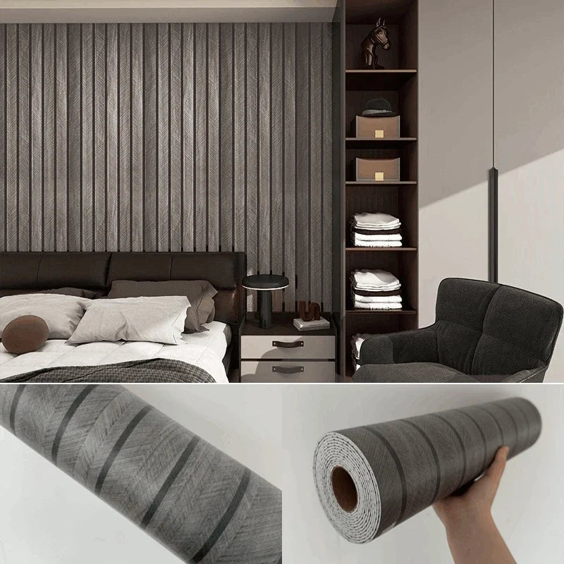 Close-up view of self-adhesive wood grain wall panels installed on a dark gray interior wall.