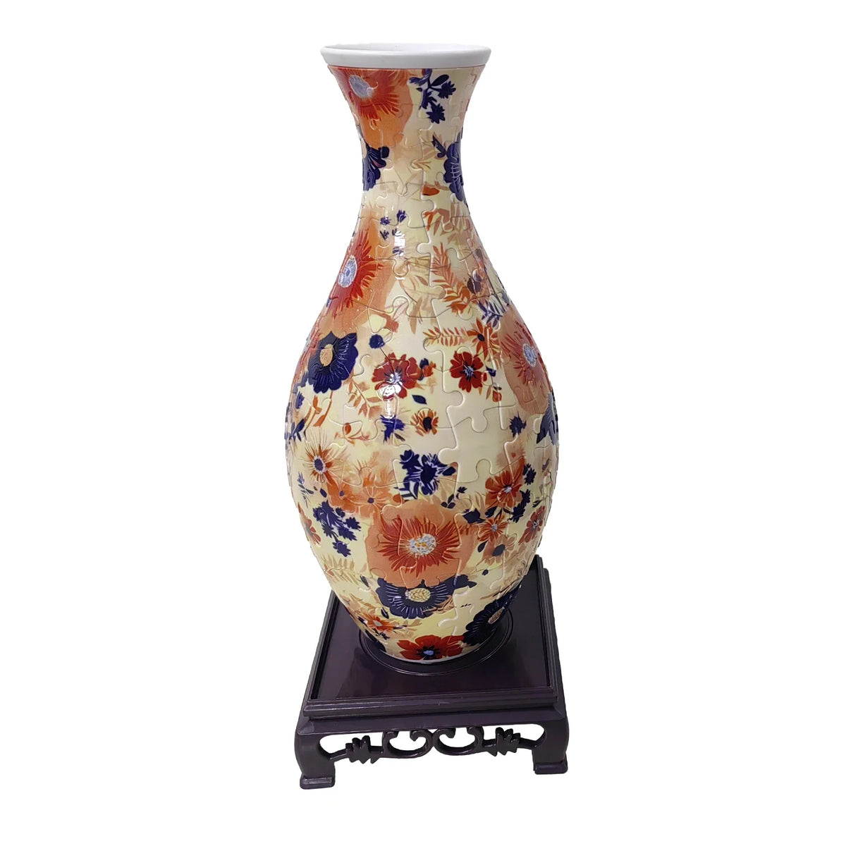A ceramic vase with floral patterns in shades of orange, blue, and cream, displayed on a dark wooden stand.
