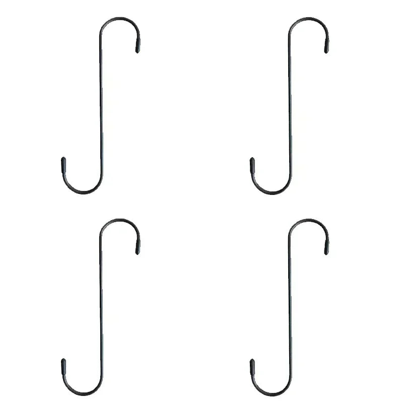 Quatre pinces de frein automobiles noires de différentes tailles et formes.