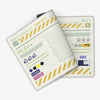 A Japanese art mouse pad featuring a green and yellow design with various icons and text on a white background.