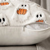 White knitted ghost pattern throw pillow cover with orange pumpkin details