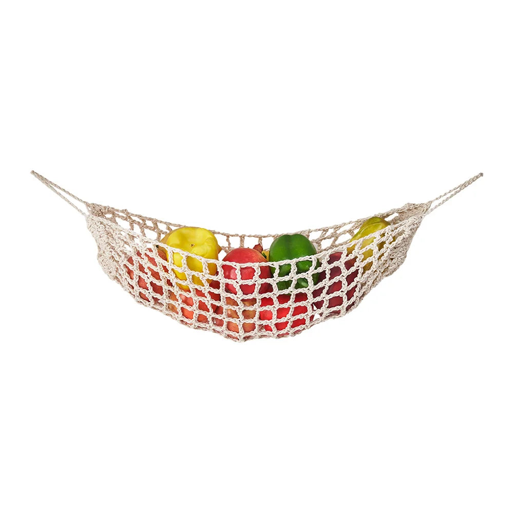 Macrame hanging fruit hammock filled with colorful fruits like apples and pears