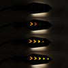 Three illuminated motorcycle turn signal indicators showing yellow and orange flashing patterns.