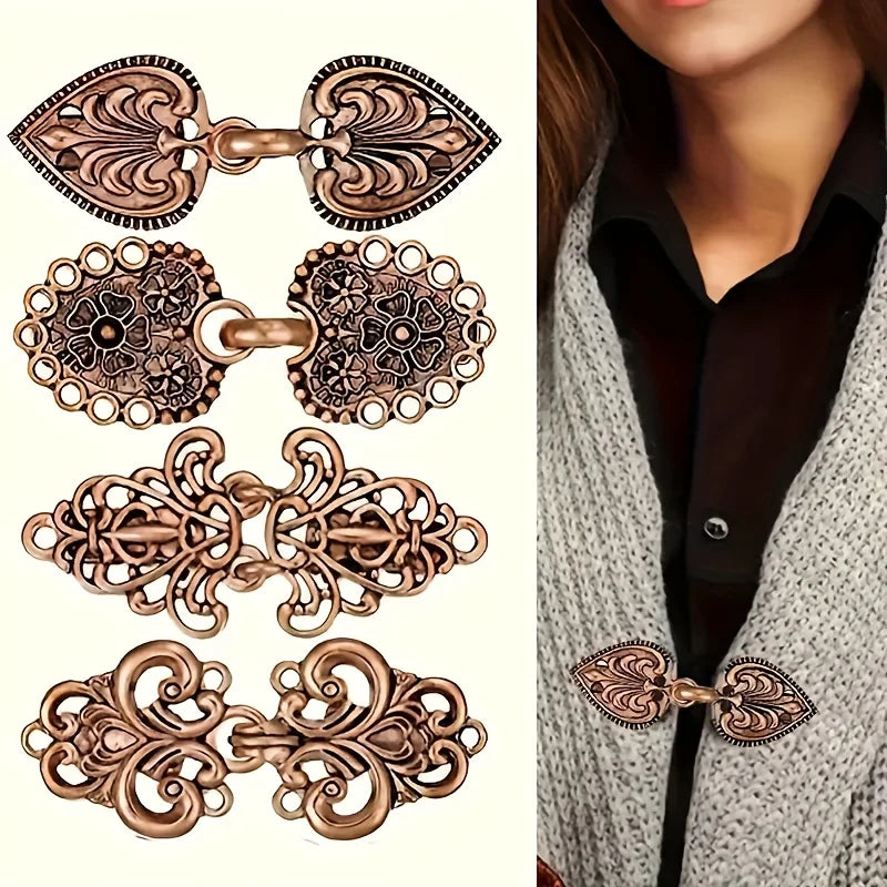 A set of vintage rose gold rotating sweater clips for cardigans and shawls shown against a gray knitted garment.