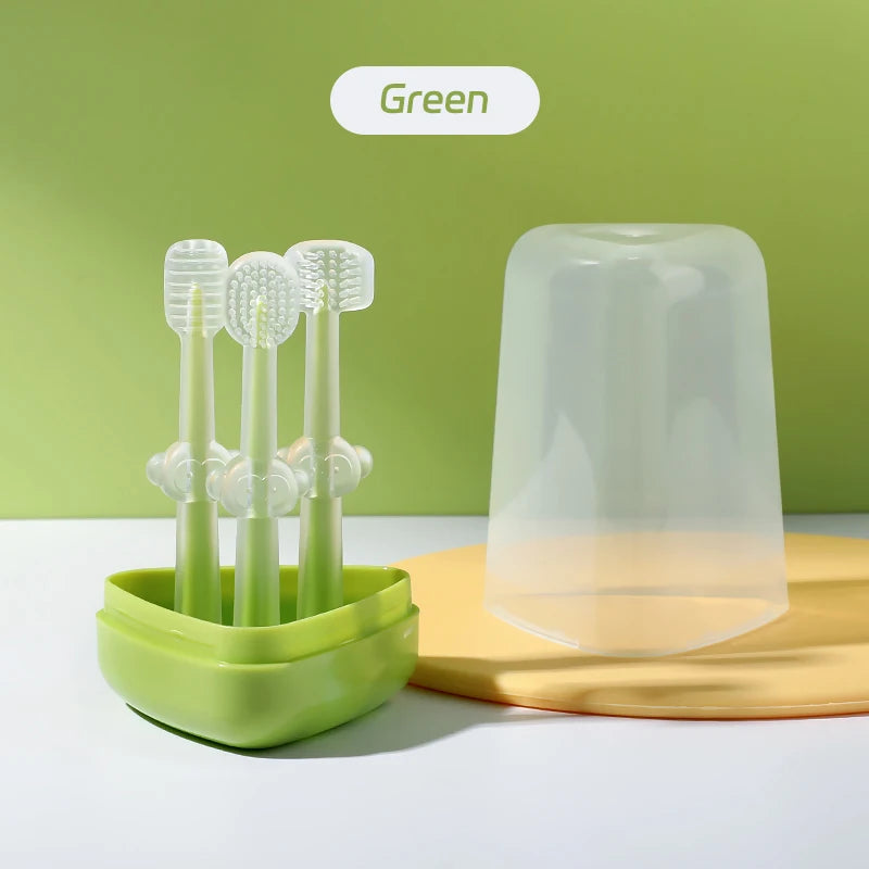 A green silicone toothbrush set with a storage case and tongue cleaner displayed on a yellow surface.