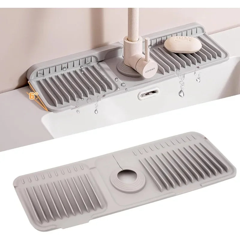 A silicone faucet splash mat with multiple drainage holes is shown mounted on a white surface.