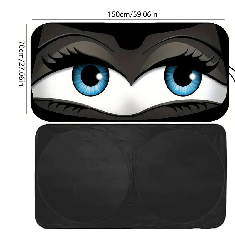 A black cartoon folding car sunshade featuring large blue eyes and detailed facial features.