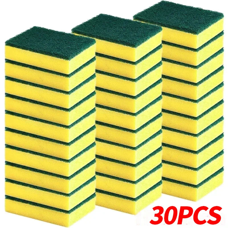 A stack of three green and yellow dual-sided scrub sponges for kitchen cleaning.