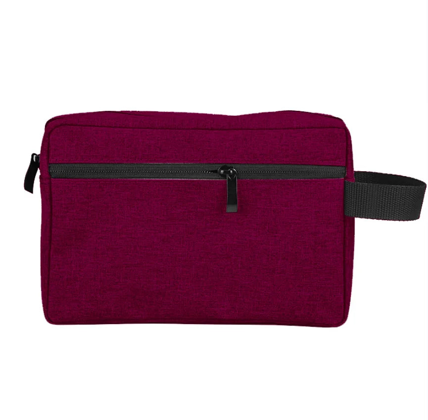 A deep purple waterproof travel toiletry bag with a black zipper and strap.
