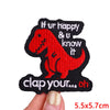 Red dinosaur embroidered iron-on patch with text saying If ur happy & u know it clap your oh