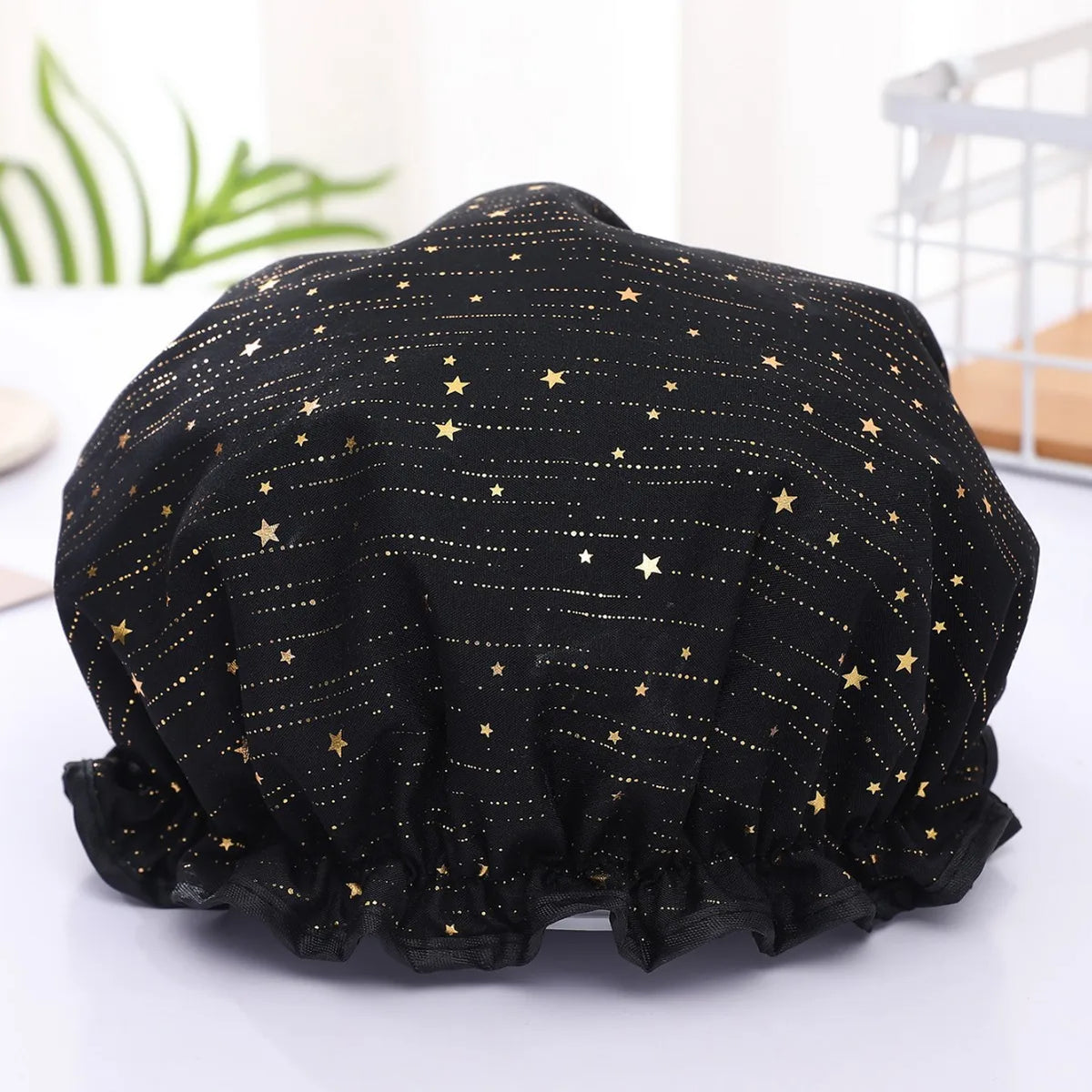 Black reusable elastic shower cap with gold star pattern