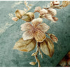 A close-up of a roll of 3D embossed floral self-adhesive wallpaper featuring delicate, sepia-toned leaves and blossoms on a m