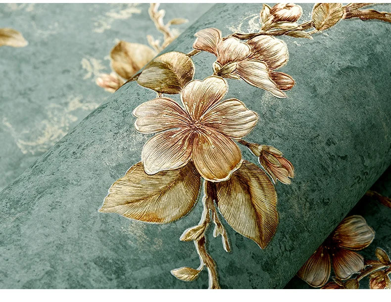 A close-up of a roll of 3D embossed floral self-adhesive wallpaper featuring delicate, sepia-toned leaves and blossoms on a m