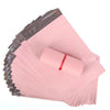 A stack of pink waterproof poly mailer shipping bags is shown from an angled view.