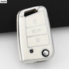 A silver TPU car key cover for VW, SEAT, and Skoda models shown against a dark background.