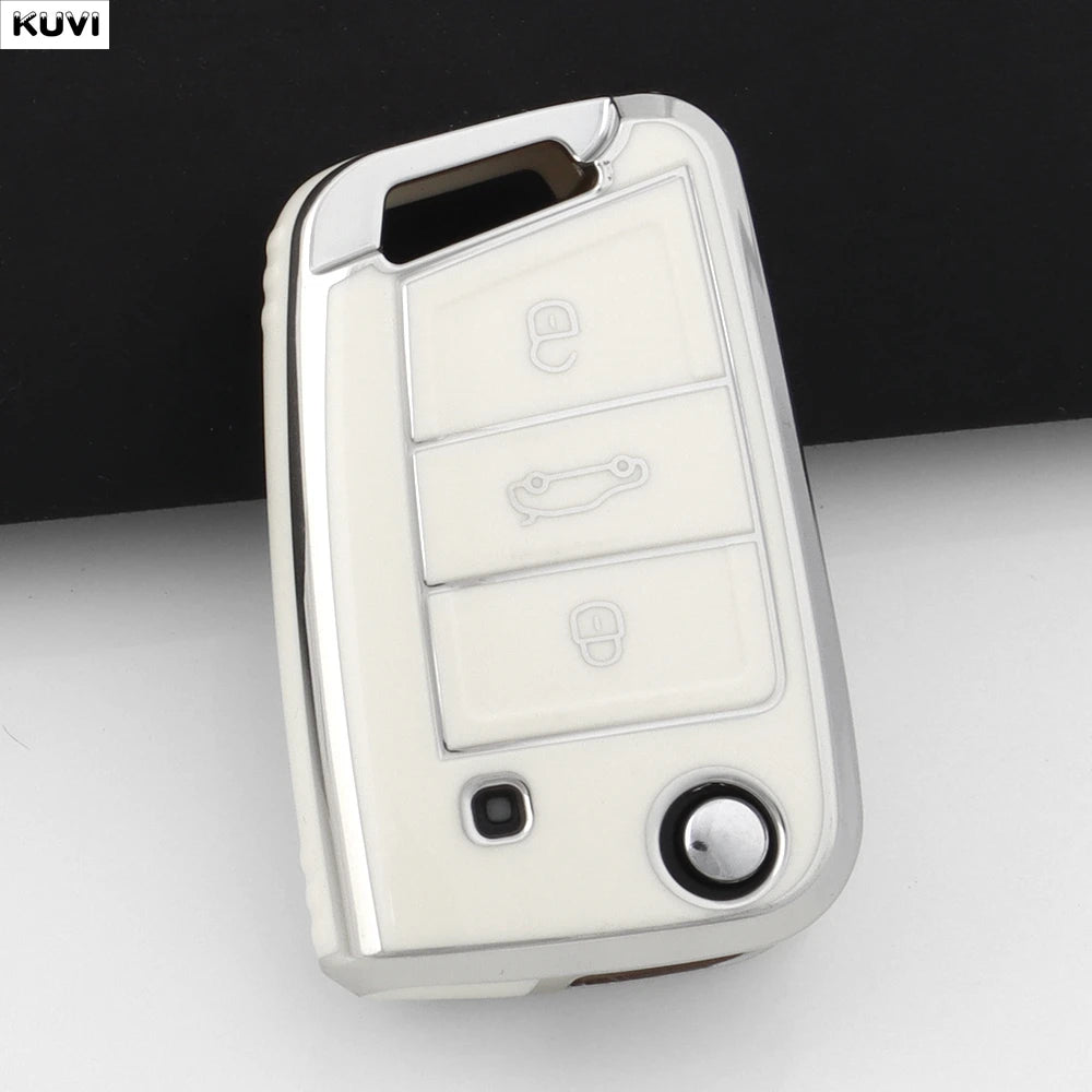 A silver TPU car key cover for VW, SEAT, and Skoda models shown against a dark background.