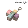 A set of five pastel colored LED mechanical keychain fidget toys with custom keycaps displayed against a white background.