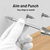 A hand in a white glove is using a screwdriver to install a double head wood nail kit into a wall.