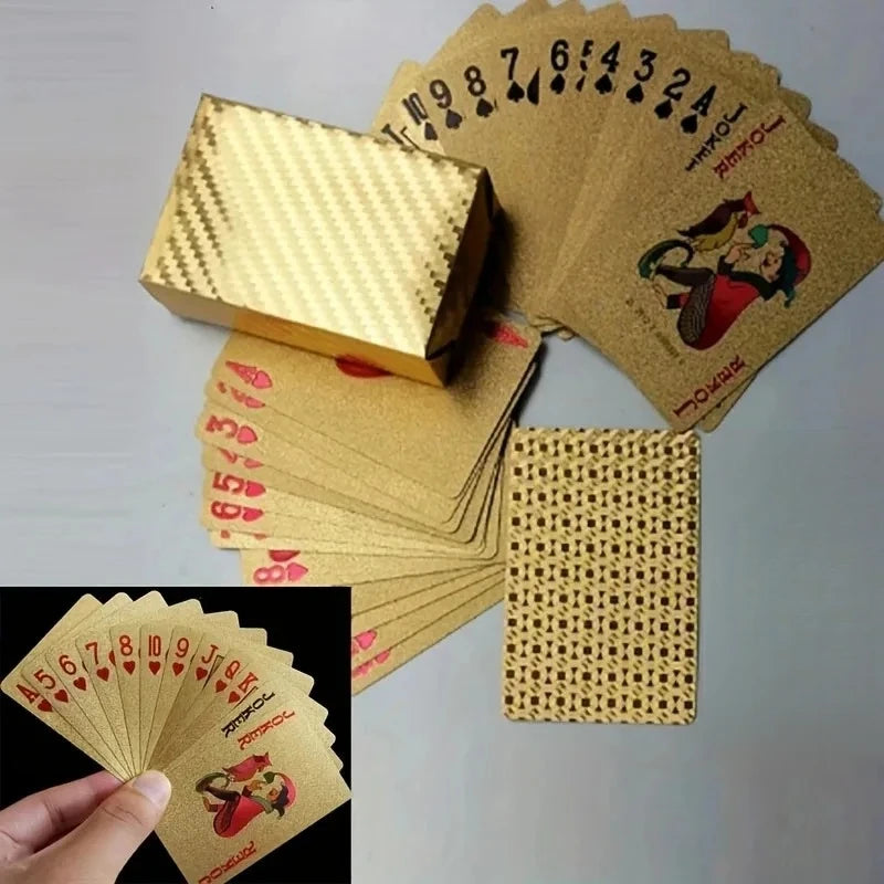 A stack of luxury gold foil playing cards and a wooden box with a checkered pattern.