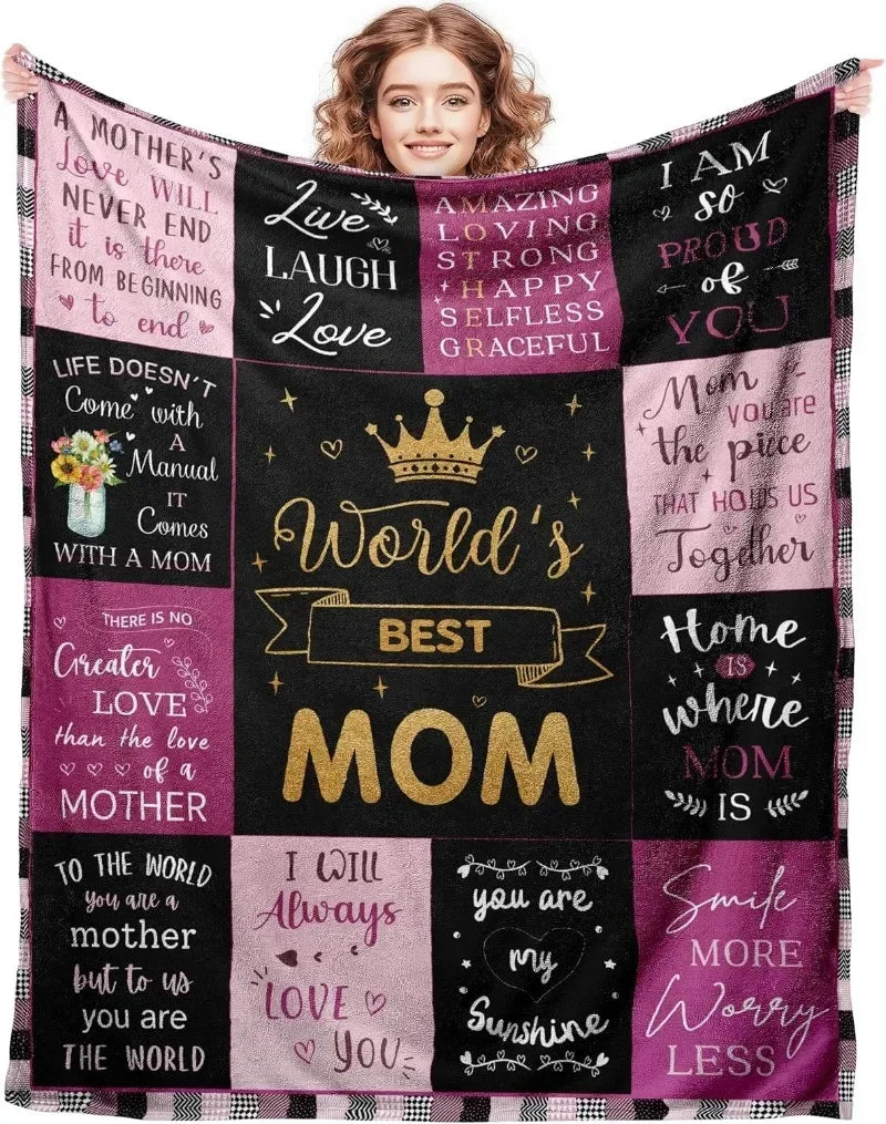 A black and pink fleece throw blanket featuring inspirational quotes about motherhood and love.