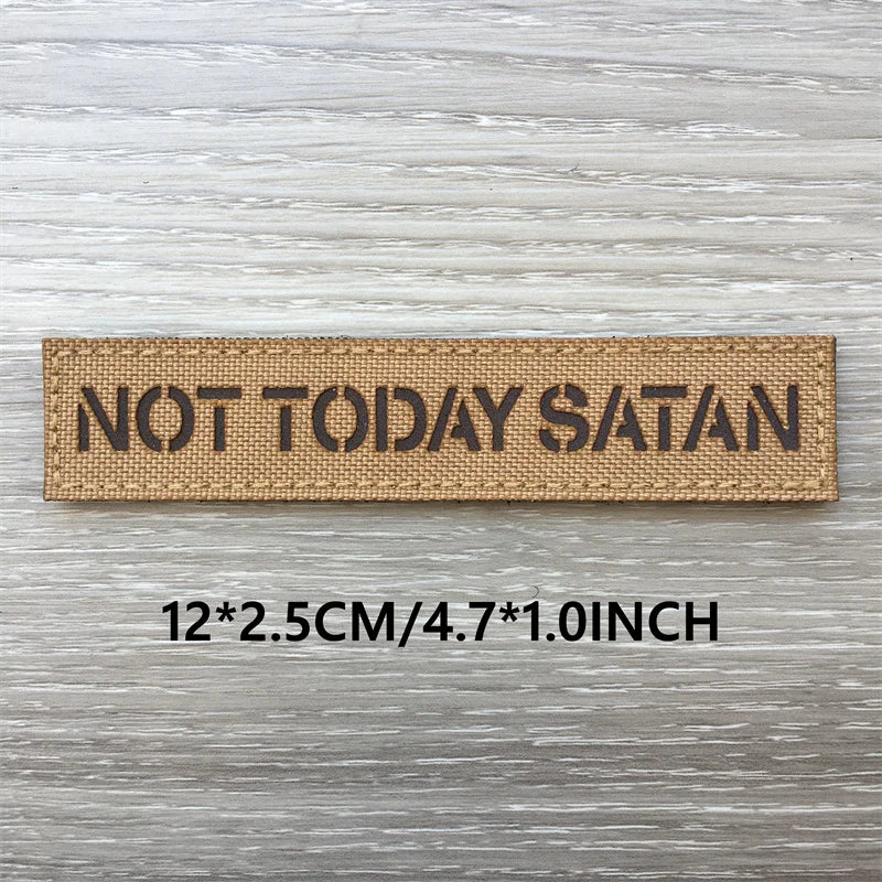 A rectangular tan woven patch with the text NOT TODAY SATAN on it, measuring 12x2.5cm or 4.7x1.0inch.