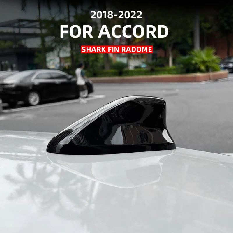 Black shark fin antenna cover installed on a white Honda Accord sedan.