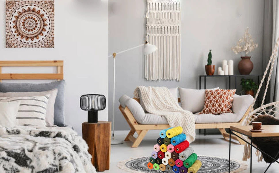A cozy living room scene featuring a macrame curtain and a wooden bed frame with white bedding.