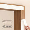 A hand is removing a white magnetic screen door from a wooden door frame, demonstrating its ability to leave no trace and fir