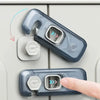 A hand is shown operating a clear plastic child safety cabinet lock mechanism on a light gray appliance panel.