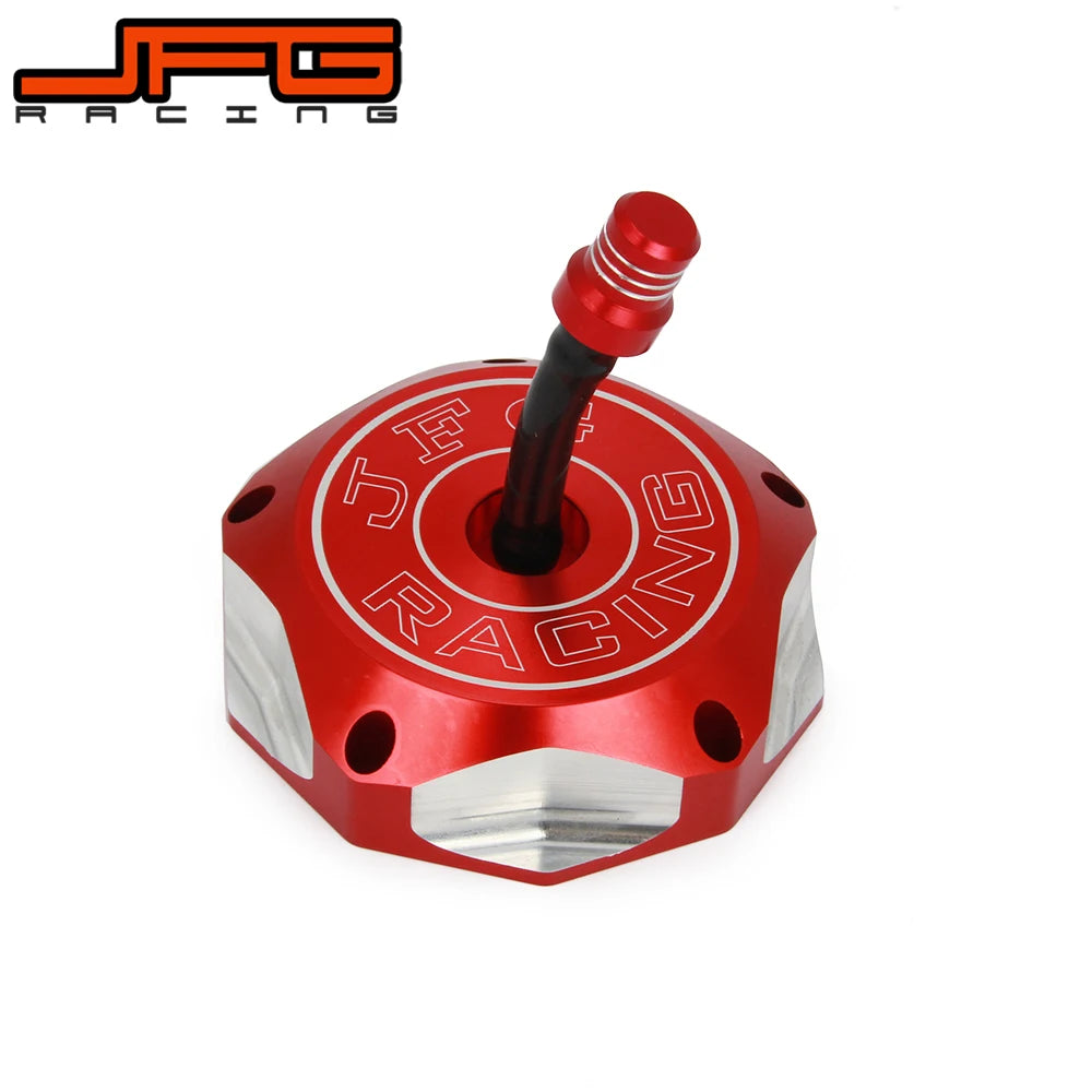 A red aluminum motorcycle fuel tank cap with a black threaded fitting and the JFG Racing logo visible.