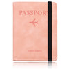 A pink leather passport wallet with a stitched edge and a black strap, featuring the word PASSPORT and travel wallet text.