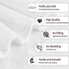 A white fleece throw blanket with various quality features listed on the side.