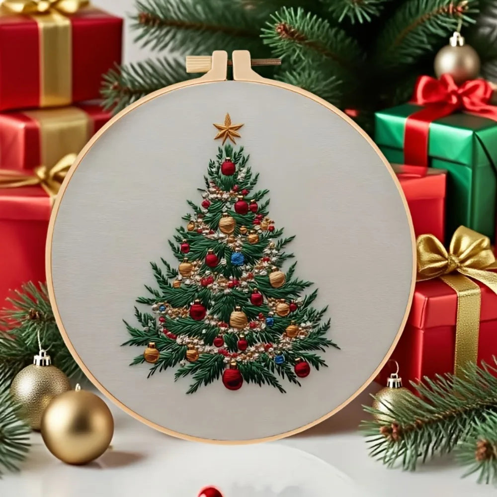 A round wooden sign featuring detailed embroidery of a festive Christmas tree surrounded by holiday decorations.