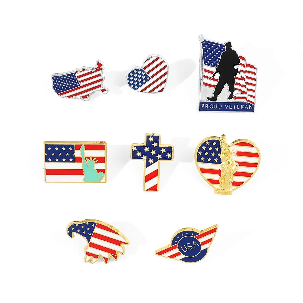 A collection of enamel pins featuring American flag designs, including a veteran silhouette, patriotic hearts, and flag cross
