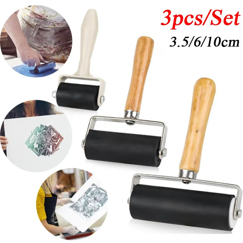 A set of three wooden-handled rubber ink rollers with black rollers for printmaking and crafting projects.