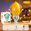 A yellow squid toy with tentacles is shown in a box, demonstrating its electric dance features.