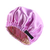 A vibrant purple satin sleep bonnet with a gathered edge and a black tie.