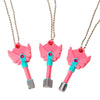 Set of four pink dagger key necklaces with silver chains and colored accents