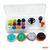 A clear storage box containing various colorful spinning top customization accessories and parts.
