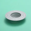 A circular silicone sink drain filter strainer with a perforated mesh design, viewed from above.