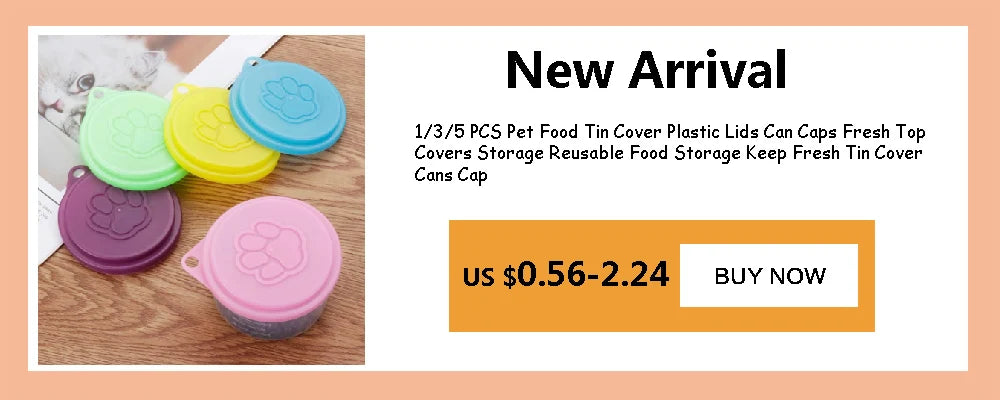 A set of three colorful silicone pet food tin covers or lids in green, yellow, and purple are displayed on a wooden surface.