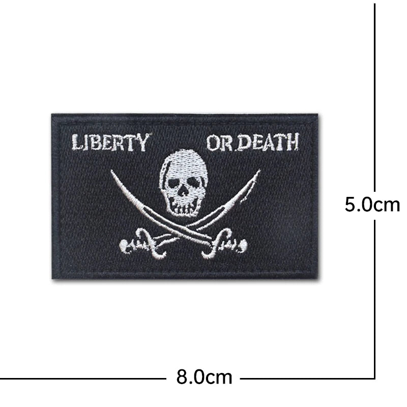 Black embroidered patch featuring a skull and crossbones design with the text Liberty or Death