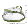 A clear microwave splatter cover with a green handle and steamer insert shown from above.